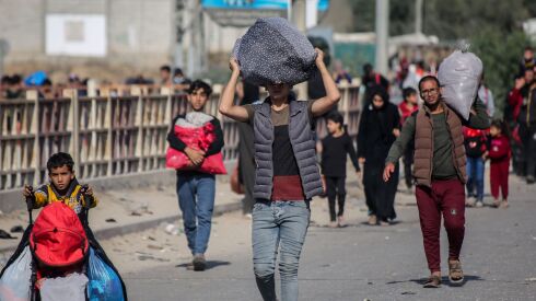 Palestinians displaced from Gaza City to the southern Gaza Strip by the Israel-Hamas war are shown heading south on Nov. 10. U.S. Secretary of State Antony Blinken said Israel must do “much more” to protect civilians in Gaza.