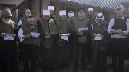 Faith leaders from the Druze, Muslim, Jewish and Christian communities hold an interfaith prayer on Nov. 29, 2023 at Kibbutz Kfar Azza near the Israel-Gaza border, the site of an Oct. 7 cross-border attack by Hamas.